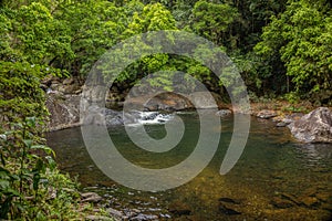 A cool swimming hole at a popular tourist destination in tropical rainforest