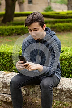 Cool teenager with fifty years old and a mobile