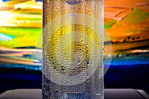 Cool water bottle on abstract background.