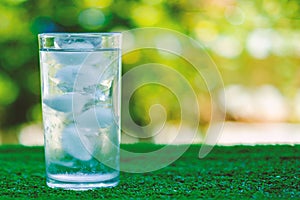 Cool water into a glass of ice