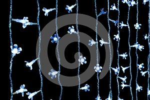 Cool-white string lights on dark background.