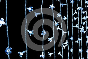 Cool-white string lights on dark background.