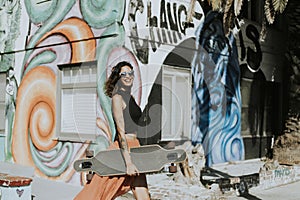Cool woman with a longboard