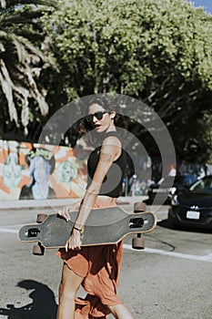 Cool woman with a longboard