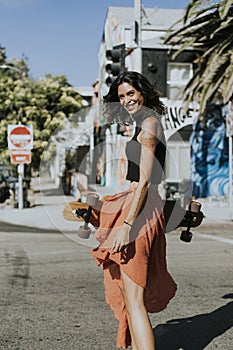 Cool woman with a longboard