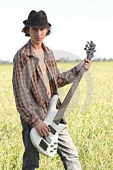 Cool young guitarist outdoors
