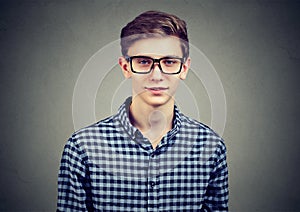 Portrait of a cool young guy in a checked shirt
