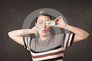 Cool youngster looking with a paper hand drawn eyes