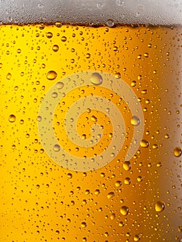 Cooled glass of beer close-up.  Small water drops on cold surface of beer glass