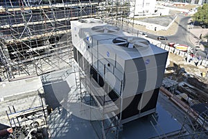 Cooling tower for air conditioning system. MEP works in civil construction site. HVAC system in the construction site.