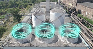 Cooling tower from a drone. Wet cooling towers. Industrial cooling towers with futuristic graphics. A futuristic shot of