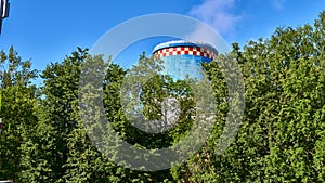 cooling tower heat station out behind trees. color