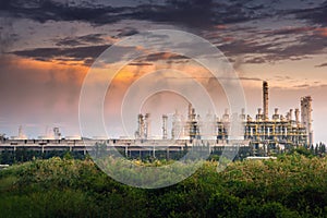 Cooling Tower of Oil and Gas Refinery Plant at Sunset. Process Buildings of Petrochemical Manufacturing., Business Engineering and