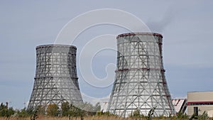 Cooling towers of CHP or thermoelectric power station. Concept of ecology, environmental protection.