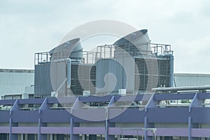 Cooling towers on daylight on the purple floor