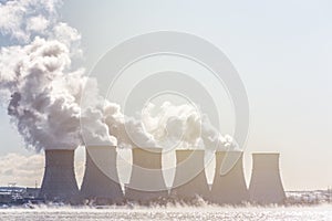 Cooling towers of a Nuclear energy station or NPP with thick smoke