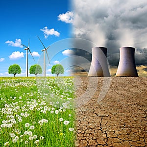 Cooling towers of a nuclear power plant in a devastated landscape and wind turbines on a meadow.