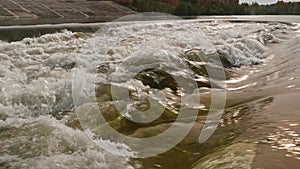 Cooling water output near nuclear power ctation in Smolensk. Strong flow of water.