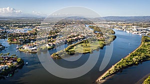 Coomera River Morning view Hope Island, Gold Coast with large housing estate