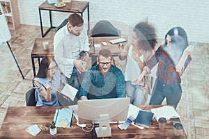 Cooperation. Group. Young. Large Bright Office.