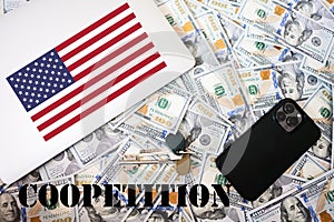 Coopetition concept. USA flag, dollar money with keys, laptop and phone background