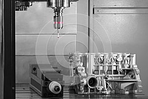 The Coordinate Measuring CMM Machine.  Repair motor block of cylinders, operator inspection dimension aluminium automotive par in
