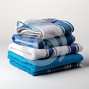 Coordinated comfort Stacked towels in blue, white, and gray showcase elegance