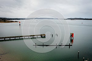 Coos Bay Oregon boat launch area with pier and jetties, drone view