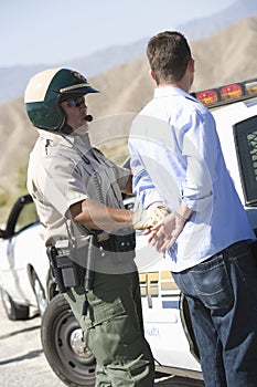 Cop Arresting Man For Breaking Traffic Rules
