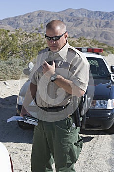 Cop Holding Walkie Talkie