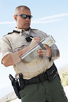 Cop Writing On Clipboard