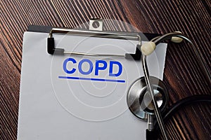 COPD write on a paperwork  on wooden table photo