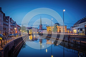 Copenhagen Canal Skyline and Slotsholmen with Nikolaj Kunsthal Tower at night - Copenhagen, Denmark