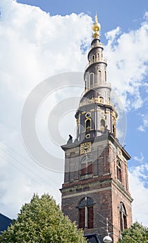 Copenhagen, Denmark - August 25, 2014 - Church tower of Our Saviour (Danish:Vor Frelsers Kirke) baroque church in Copenhagen