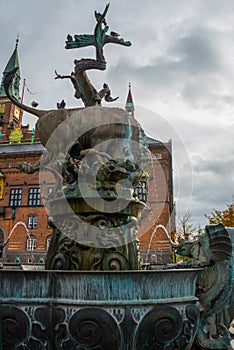 COPENHAGEN, DENMARK: A beautiful fountain with a bronze sculpture of a bull and a dragon. City Hall