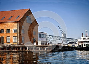 Copenhagen, Denmark: harbor installations, docks and a ship moored