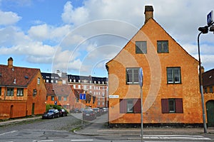 COPENHAGEN, DENMARK - MAY 31, 2017: yellow houses in Nyboder district, historic row house district of former Naval barracks