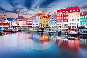 Copenhagen, Denmark. Nyhavn, Kobenhavn\'s iconic canal, colorful night water reflection