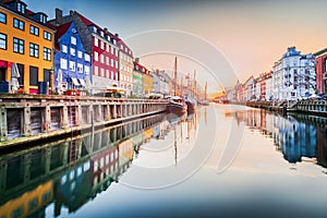 Copenhagen, Denmark. Nyhavn, Kobenhavn's iconic canal, colorful sunrise water reflection