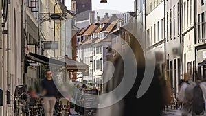 Copenhagen, Denmark, Timelapse - Poeple walking in a pedestrian street of the Danish capital during a sunny day