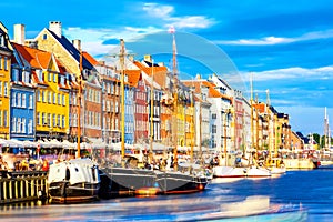 Copenhagen iconic view. Famous old Nyhavn port in the center of Copenhagen, Denmark during summer sunny day