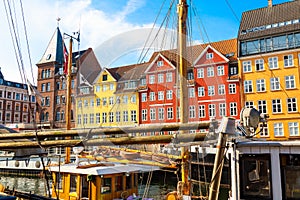 Copenhagen iconic view. Famous old Nyhavn port with colorful medieval houses in the center of Copenhagen, Denmark during summer
