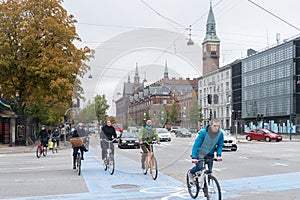 Copenhagen - October 23, 2016: Cyclers passing by a street in Copenhagen.