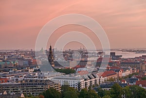 Copenhagen skyline with industrial harbor area at sunrise