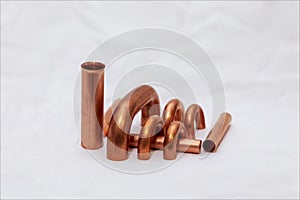 Copper accessories, objects for the industrial construction of heat exchangers for food refrigeration.