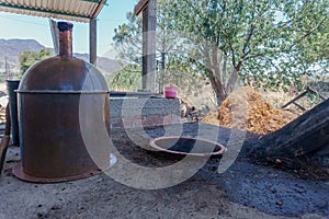 copper alembic ready to distill mezcal photo