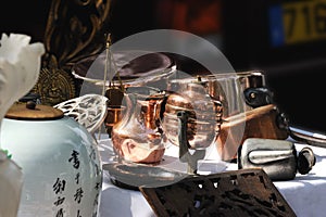 Copper and brass utensils on a French flea market