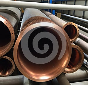 Copper bronze heat exchanger pipes. Heavy non-ferrous metallurgy. Factory industrial production of metal cuprum pipes