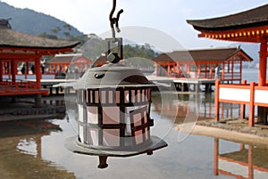Copper candle lantern at Itsukushima Shrine photo