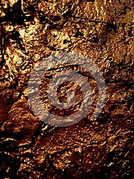 Copper Colored Rugged Rock Wall photo